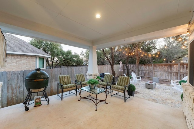 view of patio / terrace with area for grilling and an outdoor fire pit