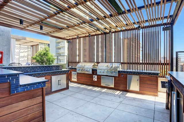 view of patio featuring area for grilling, grilling area, and a pergola