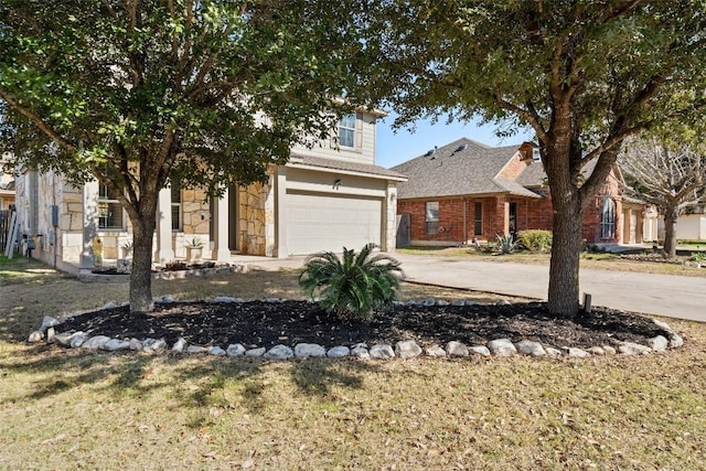 view of front of home featuring a garage and a front lawn