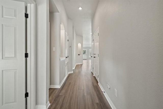 hallway featuring dark hardwood / wood-style floors