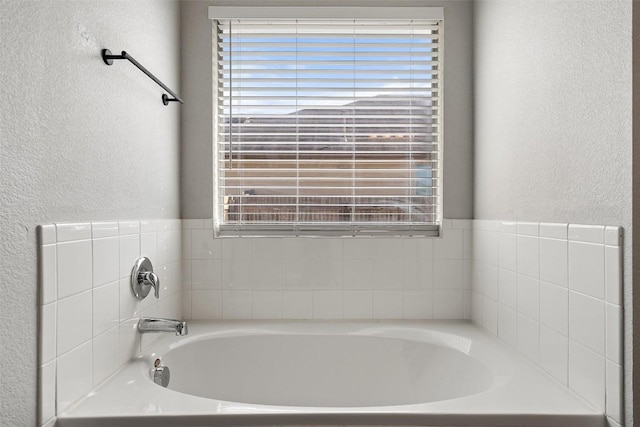 bathroom with a tub