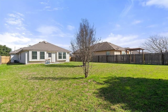 rear view of house featuring central AC, a pergola, a patio area, and a lawn