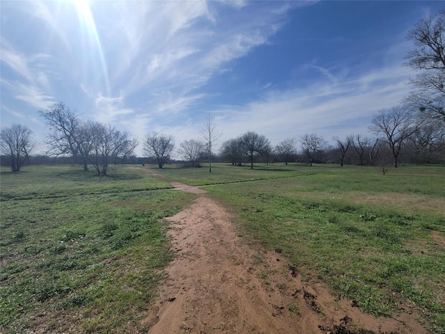 view of yard with a rural view