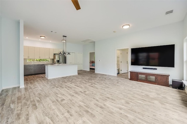 unfurnished living room with light hardwood / wood-style flooring