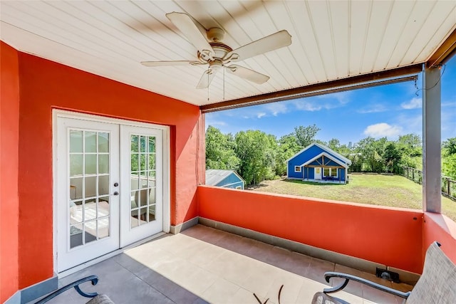 sunroom with ceiling fan and french doors