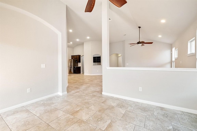 unfurnished room featuring vaulted ceiling and ceiling fan