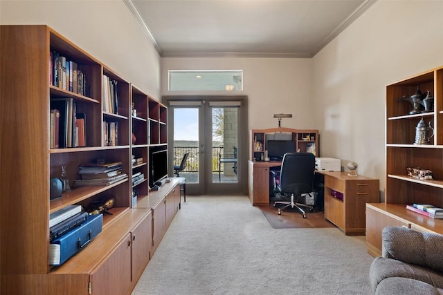 home office featuring french doors, ornamental molding, and light carpet