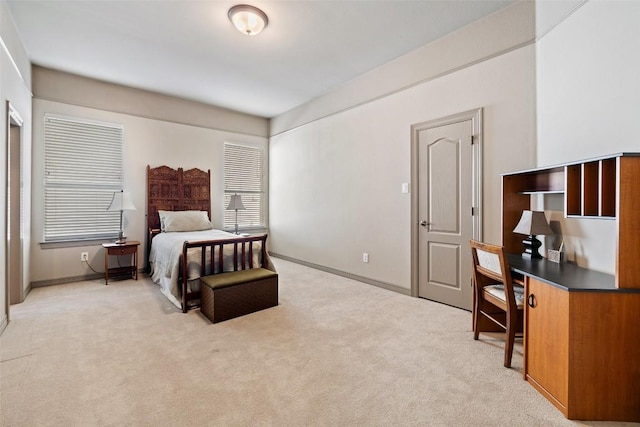 bedroom with light colored carpet