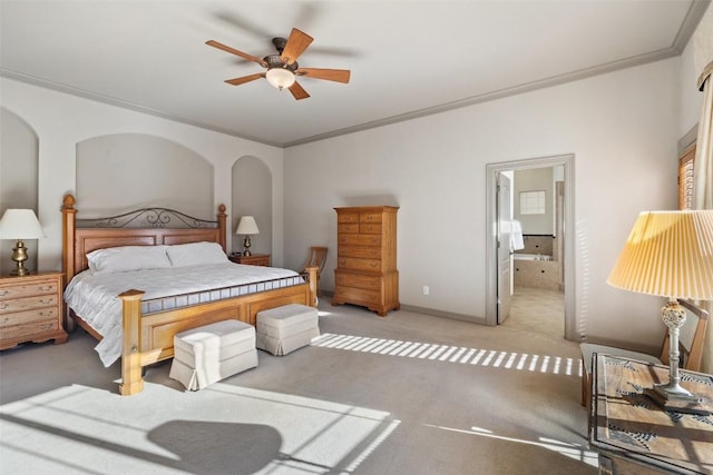 bedroom with ornamental molding, light colored carpet, ceiling fan, and ensuite bathroom