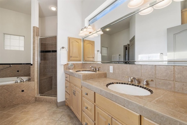 bathroom with tile patterned flooring, decorative backsplash, and independent shower and bath