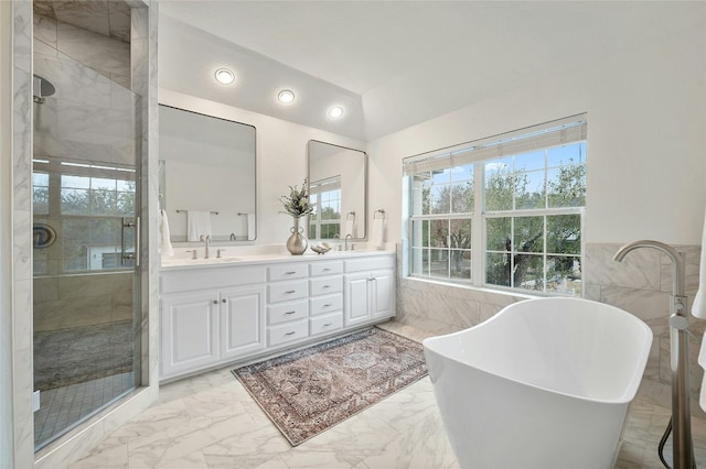 bathroom with lofted ceiling, vanity, plus walk in shower, and tile walls