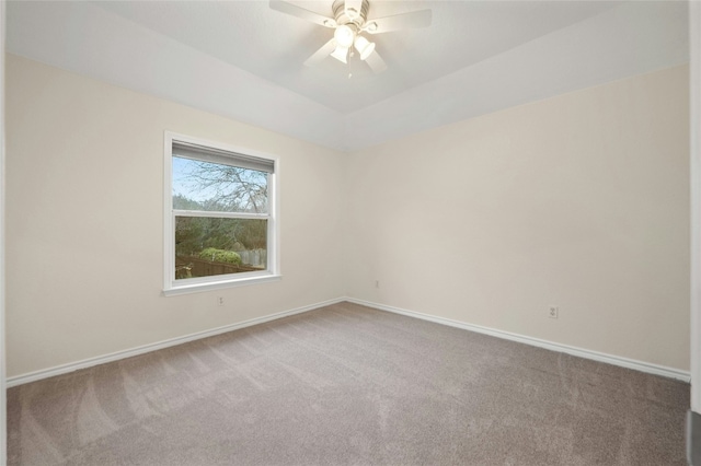 carpeted spare room with ceiling fan