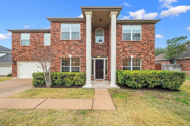 view of front of property featuring a garage and a front lawn