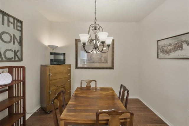 113 Hampton Cir, Georgetown, TX 78633 - dining space with dark wood-style floors and a chandelier