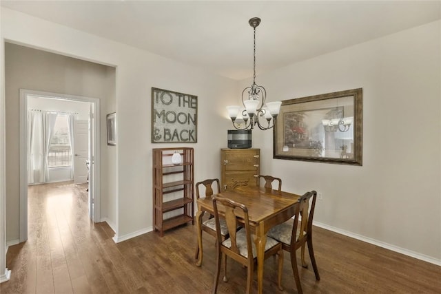 113 Hampton Cir, Georgetown, TX 78633 - dining space featuring a chandelier and dark wood-style floors
