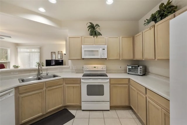 113 Hampton Cir, Georgetown, TX 78633 - kitchen featuring white appliances, light brown cabinetry, light tile patterned floors, light countertops, and recessed lighting