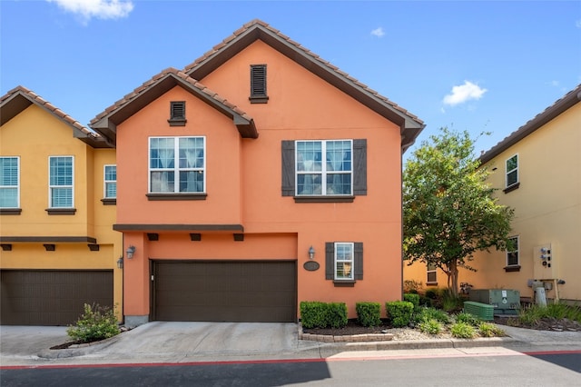 12332 Terraza Cir, Austin, TX 78726 - multi unit property with stucco siding, a garage, driveway, and a tile roof