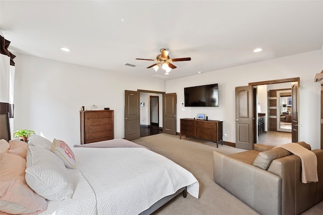 bedroom featuring a ceiling fan, recessed lighting, visible vents, and light colored carpet