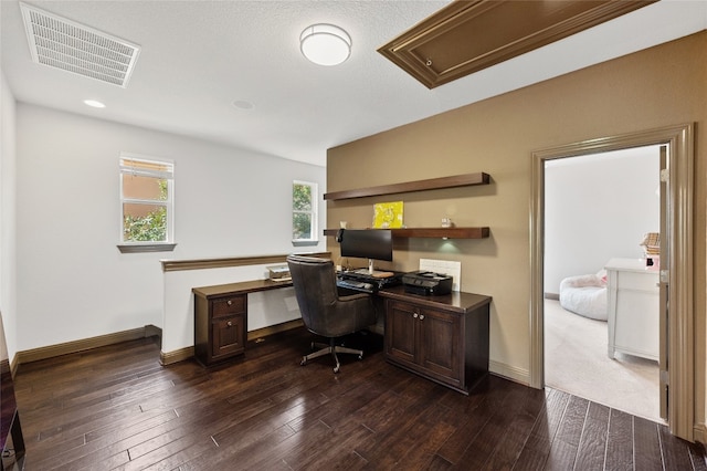 12332 Terraza Cir, Austin, TX 78726 - home office featuring dark wood finished floors, built in desk, baseboards, and attic access