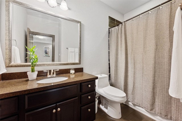 bathroom with vanity, tile patterned floors, and toilet