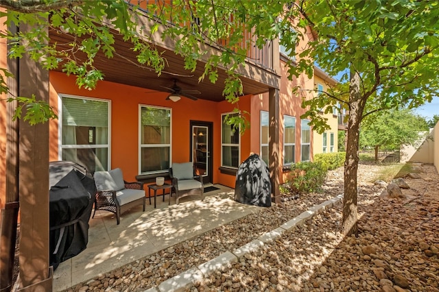 view of patio / terrace featuring a ceiling fan and fence