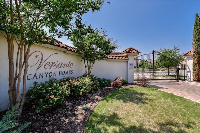 12332 Terraza Cir, Austin, TX 78726 - community sign featuring a gate and a lawn