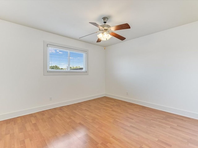 spare room featuring ceiling fan and light wood-type flooring