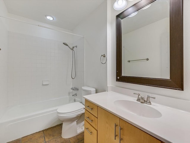 full bathroom featuring tiled shower / bath combo, vanity, tile patterned floors, and toilet