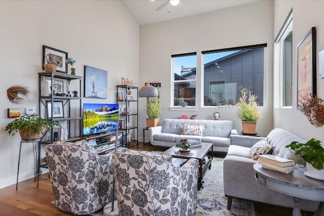 living room with hardwood / wood-style flooring and ceiling fan