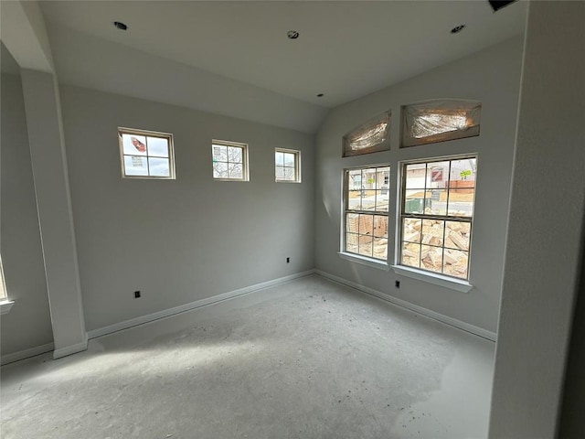 empty room with vaulted ceiling