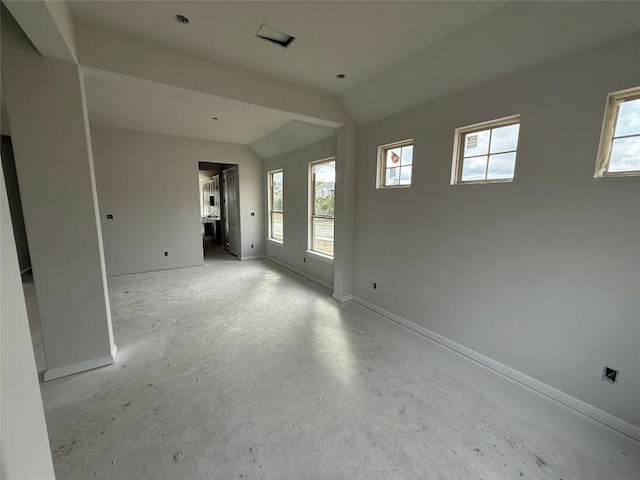 empty room with lofted ceiling