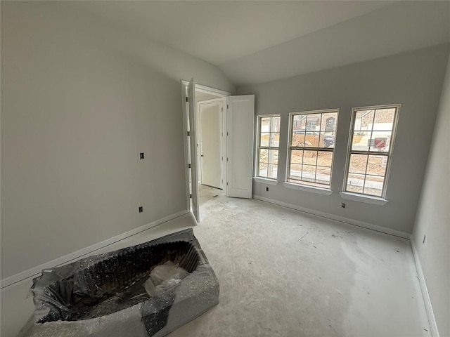 unfurnished bedroom with vaulted ceiling