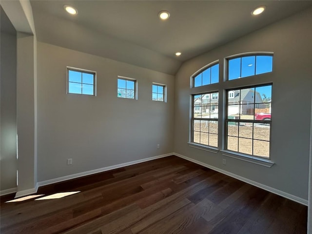 spare room with dark wood-style floors, recessed lighting, and baseboards