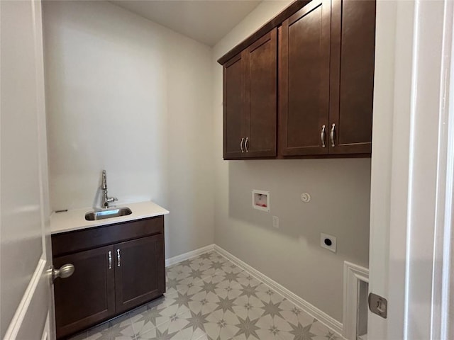 laundry area featuring hookup for a washing machine, hookup for an electric dryer, a sink, cabinet space, and light floors