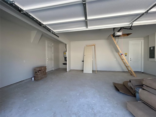 garage with electric panel and a garage door opener