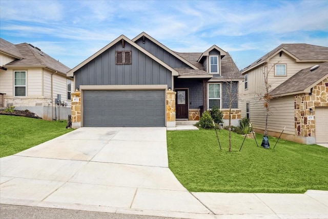 craftsman inspired home with a garage and a front lawn