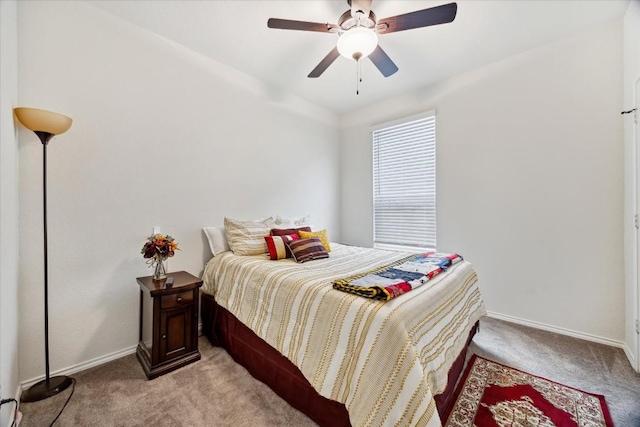 bedroom featuring light colored carpet and ceiling fan