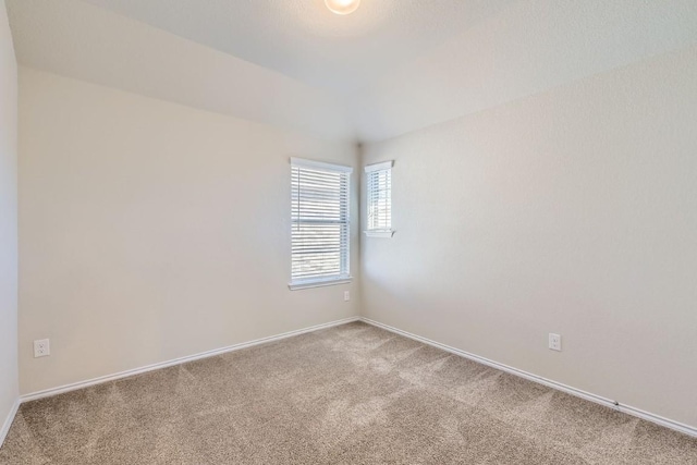 empty room with carpet flooring