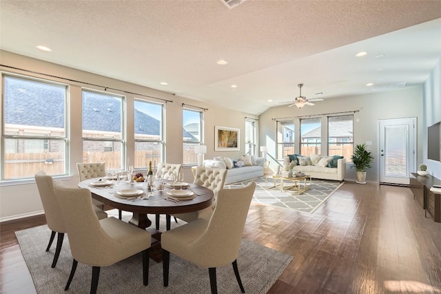 dining area featuring a textured ceiling, dark wood-type flooring, and recessed lighting