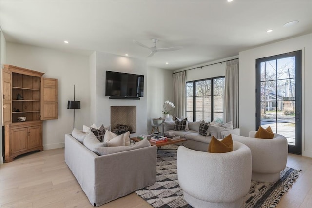 1702 Bauerle Ave, Austin, TX 78704 - living room featuring light wood-type flooring, recessed lighting, ceiling fan, and a fireplace