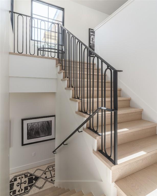 1702 Bauerle Ave, Austin, TX 78704 - staircase featuring baseboards