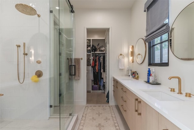 bathroom featuring vanity and an enclosed shower