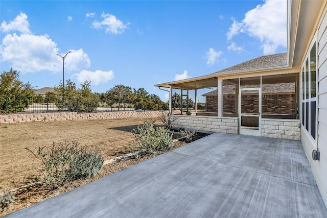 view of patio / terrace with a sunroom