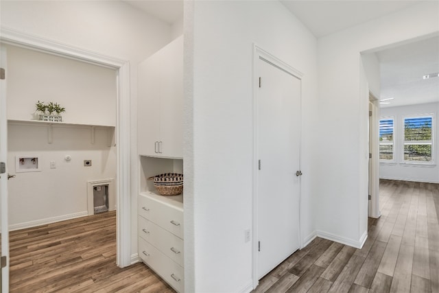 hallway with wood-type flooring