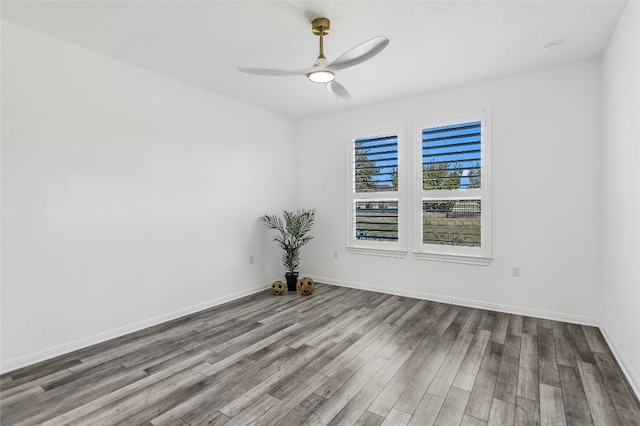 empty room with ceiling fan and light hardwood / wood-style flooring