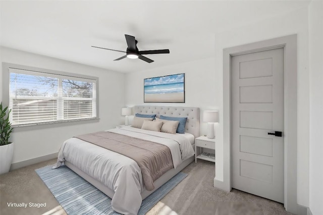 bedroom featuring light carpet and ceiling fan