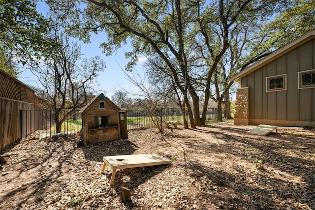 view of yard featuring an outbuilding and a fenced backyard