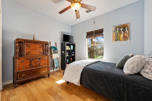 bedroom featuring ceiling fan and light hardwood / wood-style floors