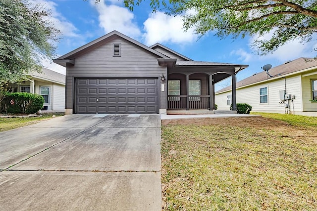 single story home with a garage, a front lawn, and a porch