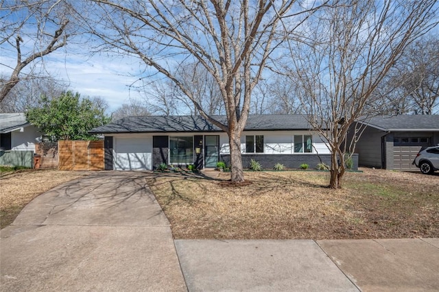 single story home featuring a garage